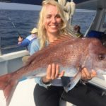 Lady holding large red snapper - Evans Head, NSW