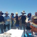 Tourists showing freshly caught fishes in Summer 2017-2018