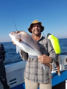 Man showing freshly caught Reef Fish in Winter 2018
