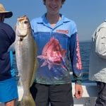 Man holding Yellowtail Kingfish on Summer 2018-2019