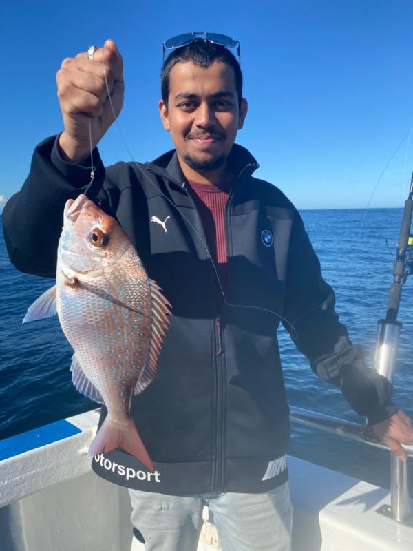 Young Man caught a Reef Fish in Autumn-Winter 2020